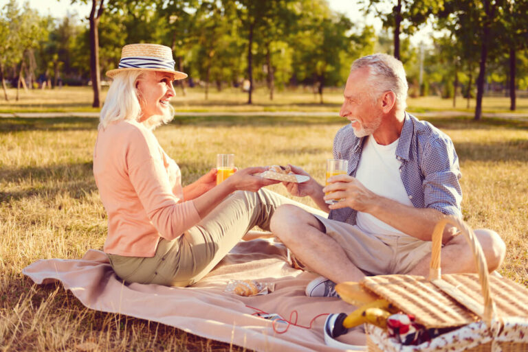Gaines Park Senior Living | Senior couple picnicking outdoors